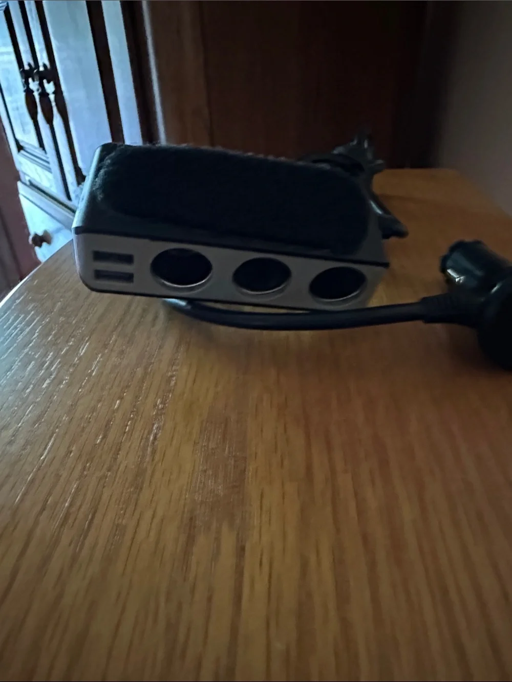 Black In-Car Charger Adapter with Integrated Cable